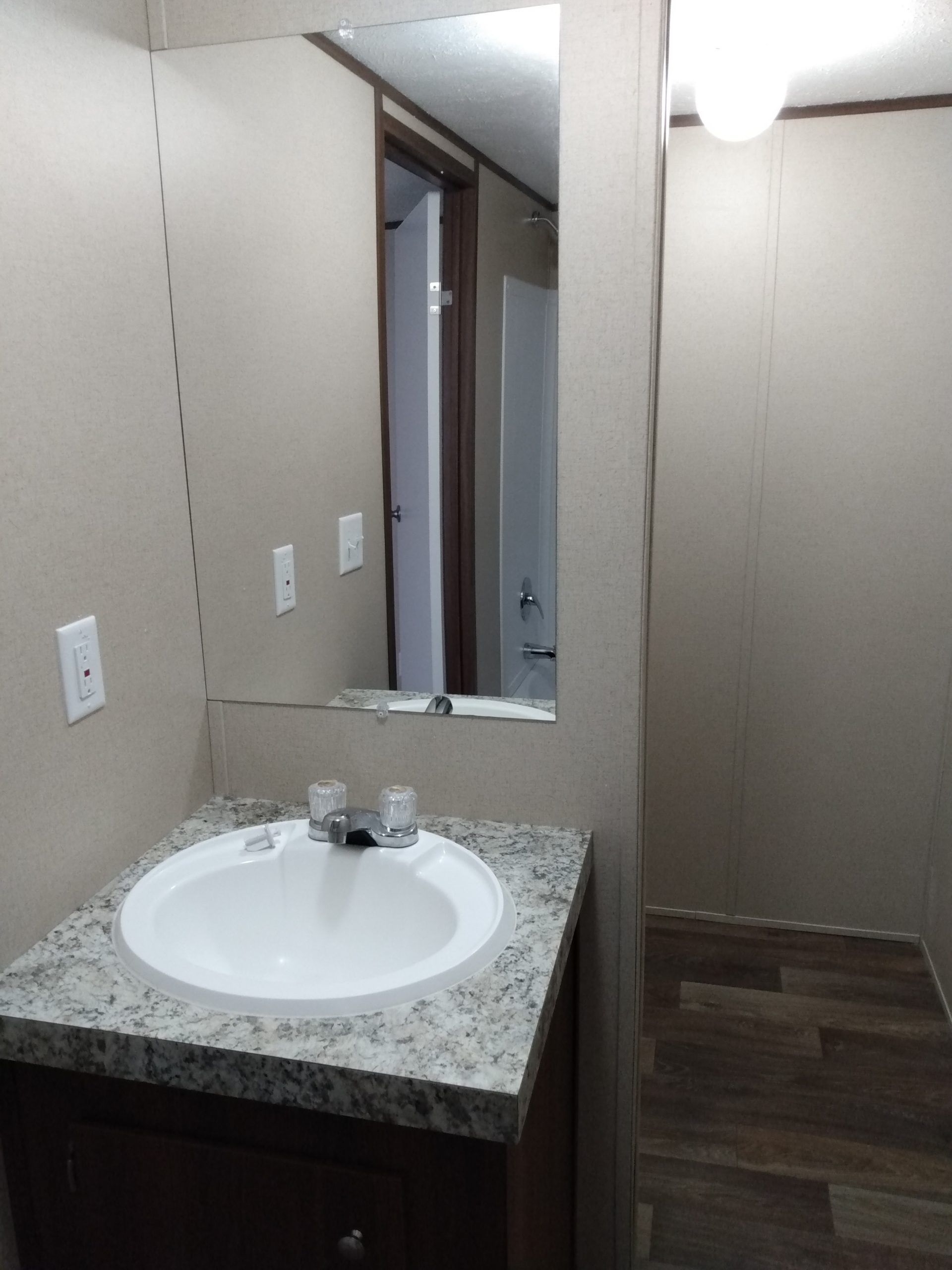 Bathroom vanity with a sink and mirror